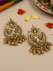 Antique gold bridal Chandbali earrings with a crescent-shaped design, floral Kundan Polki detailing and decorative jhumka bead drops