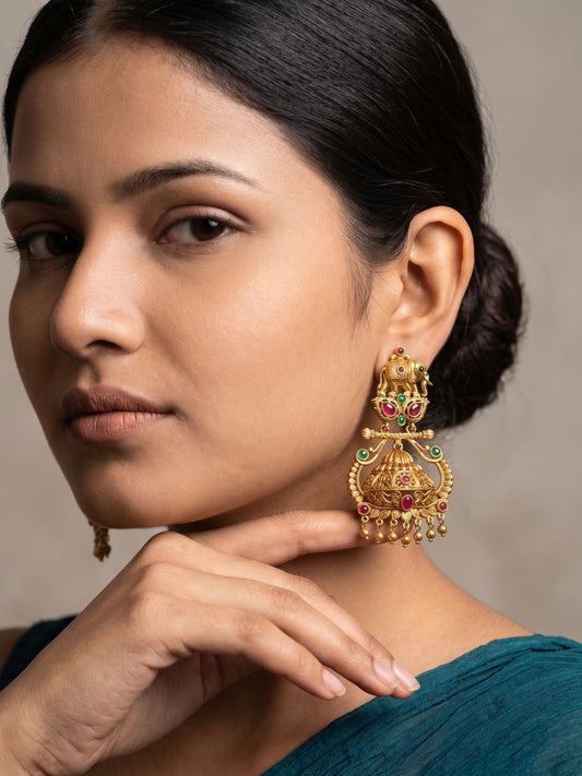 Antique gold Elephant Temple Jhumka earrings with traditional elephant motifs, Kundan stones, colourful gemstones and dome-shaped jhumka detailing.