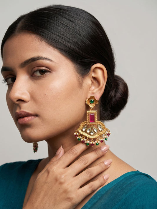 Antique gold ethnic earrings with Kundan mirrorwork, ruby-pink and emerald-green stones, intricate detailing and pearl bead danglers