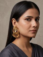 Antique gold Chandbali earrings with floral detailing, Kundan Polki stones, ruby and emerald accents and elegant bead danglers