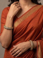 A women wearing Luxury Antique Victorian Polki Kada Bangles With Emerald Stones | Wedding & Bridal Kada Bangles