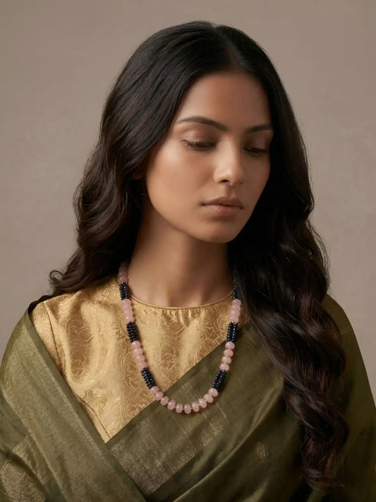Blue and pink beaded necklace set featuring rose quartz beads, layered blue hydro beads, gold-tone accents and matching drop earrings for festive looks