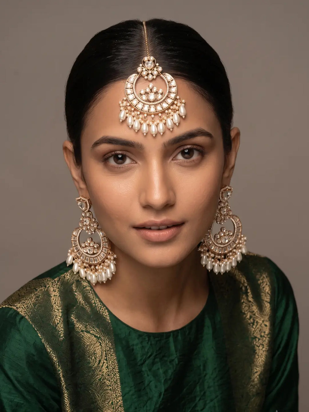 Bridal Model Styled in Kundan Chandbali Earrings and Maang Tikka with Lehenga