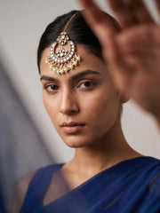 Close-Up of Model Wearing Moon-Shaped Kundan Maang Tikka with Pearl Drops