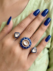 Navy blue gold plated Kundan double finger ring with enamel and Polki stones, designed as a statement accessory for weddings and celebrations.