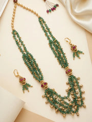 Gold tone green beaded ethnic necklace with layered jade beads, decorative golden accents and coordinated earrings with pink stone details