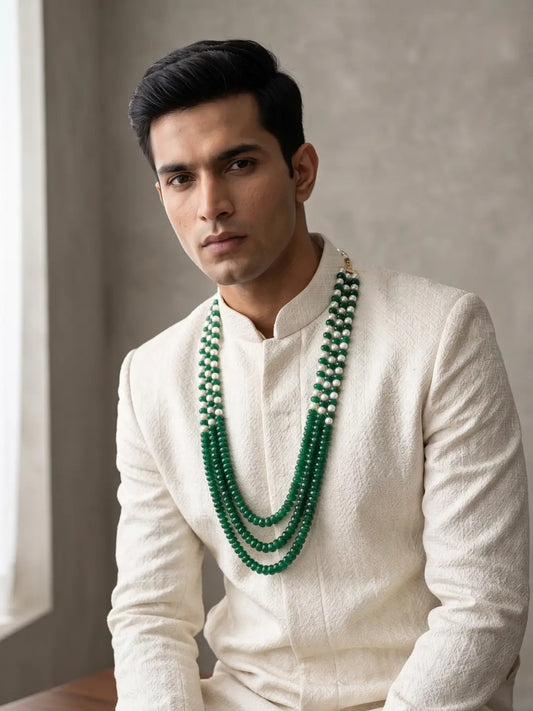 Green and white dulha mala featuring multiple shell pearl strands, faceted green jade gemstone beads and adjustable dori