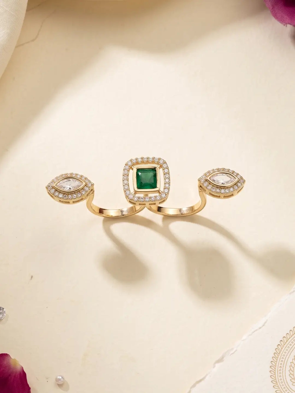 Green gold plated square Polki double finger ring with marquise-shaped CZ motifs, styled as a statement accessory for bridal and wedding outfits.