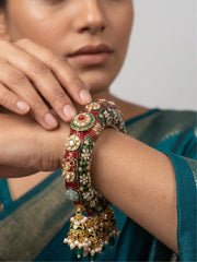Green Kundan Meenakari bridal kada with cascading jhumka and bead drops, featuring gold plating and ornate detailing for wedding outfits.