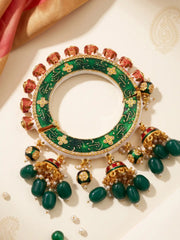 Green Kundan Meenakari Pacheli kada bangle with pearl accents, floral details and jhumka drops, designed for bridal and festive outfits.