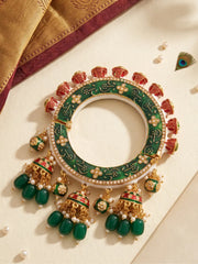 Green Meenakari Kundan Pacheli kada with floral motifs, pearl accents and jhumka details, styled as a statement bangle for ethnic outfits.