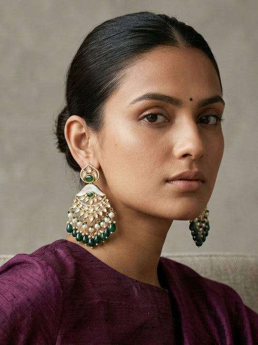 Green Mother of Pearl Chandbali earrings with Kundan Polki stones, crescent detailing and cascading pearl drops in a gold plated finish.