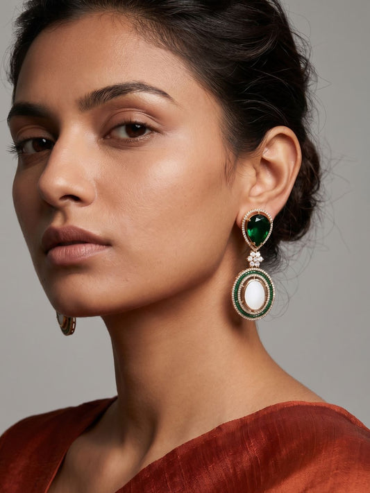 Green gold plated dangler earrings with a pear-shaped stone, Mother of Pearl centre, American diamond detailing and intricate beadwork.