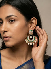 Green Polki Kundan Chandbali earrings with gold plating, emerald enamel accents, sparkling stones and multiple pearl danglers.