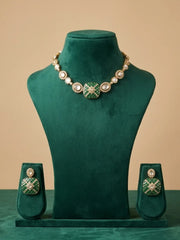 Green Polki statement necklace set featuring Kundan-style stones, CZ accents and enamel detailing, styled with traditional Indian outfits.