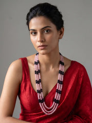 Long pink and blue beaded mala for women with gold plating, layered gemstone beads and shell pearls, styled with traditional Indian outfits.