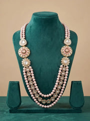 Maharaja-style pink pearl groom necklace with cascading strands and Kundan Polki brooches, styled for wedding sherwanis and reception outfits.