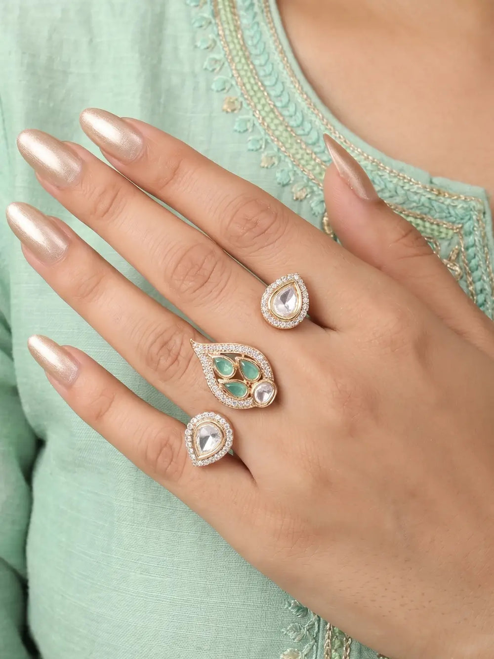 Mint green gold plated double finger ring with CZ, Polki-style and colourful stones, designed for bridal, wedding and festive occasions.