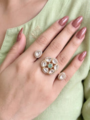 Mint green Polki Kundan double finger ring with two gold-tone bands, floral stonework and sparkling CZ accents for bridal and traditional occasions