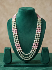 Pink and mint green jade beads alternate with white faux pearls in this multi-strand dulha necklace, creating a pastel statement accessory for weddings.