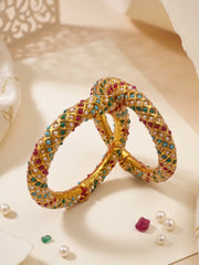 Multicolor Jadau bangles featuring a diamond-lattice pattern with pearl and stone accents, styled with an Indian ethnic outfit.