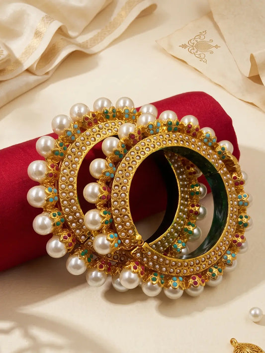 Multicolour gold plated Pearl Pacheli Jadau bangles with pink, green, blue and pearl accents, designed for weddings and festive ethnic outfits.