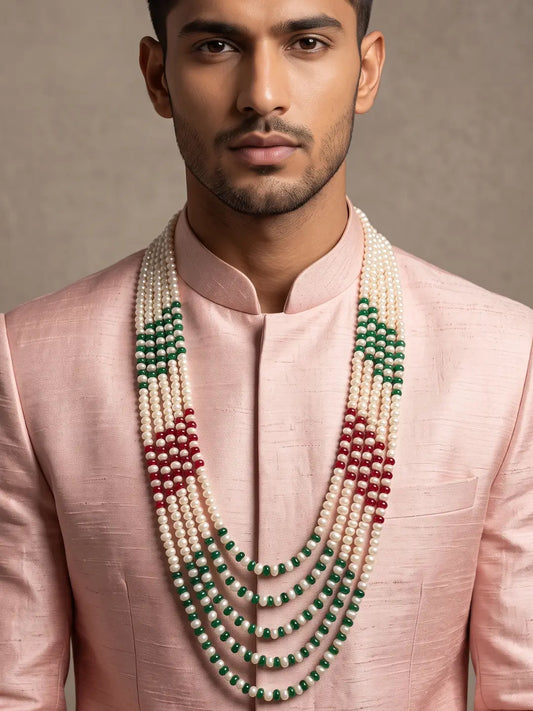 Layered white freshwater pearl groom mala with emerald green and ruby red jade beads for traditional sherwani wedding styling