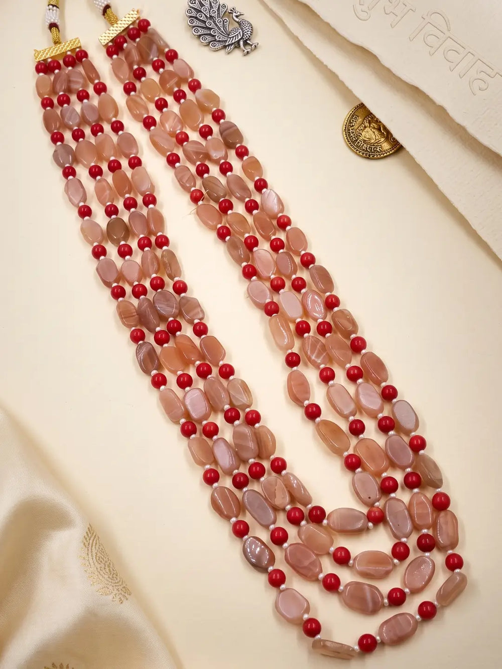 Natural red coral and moonstone beaded necklace with multiple layered strands and gold-plated details for wedding and occasion styling.