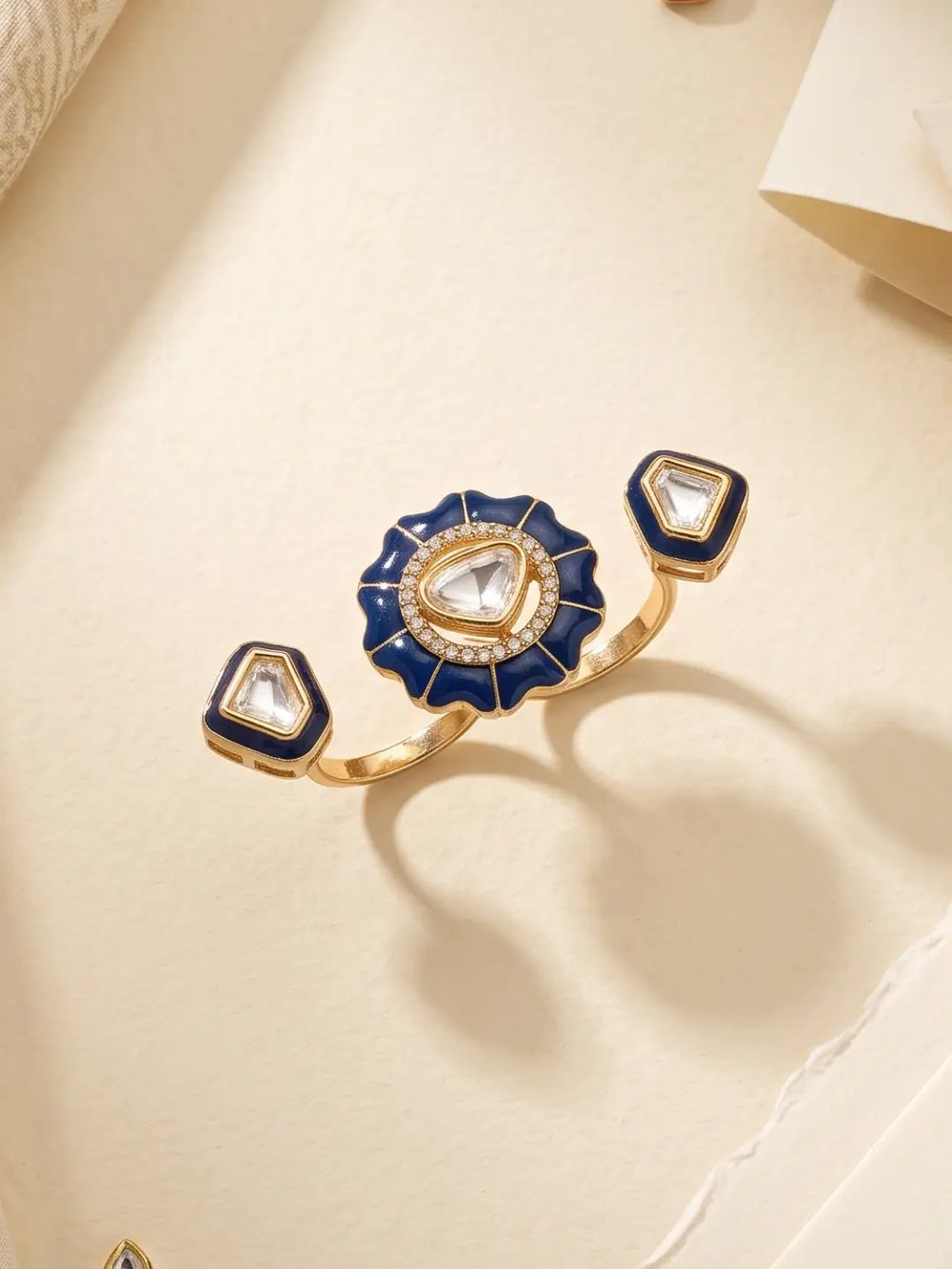 Navy blue Kundan double finger ring with gold plating, enamel detail and Polki stones, ideal for festive outfits, weddings and cocktail looks.