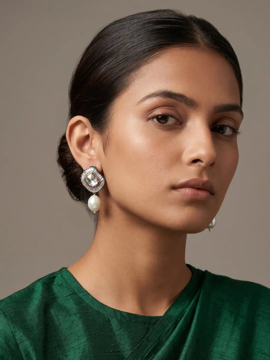 Silver plated oxidized Kundan pearl drop stud earrings with central white Kundan, sparkling CZ stones and geometric detailing