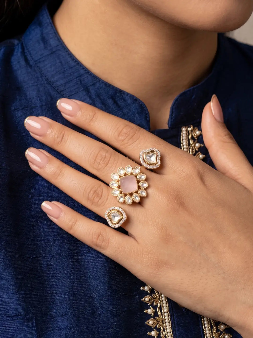 Pink Kundan Polki and CZ double finger ring with gold plating, featuring a floral design for bridal, wedding, mehendi and festive styling.