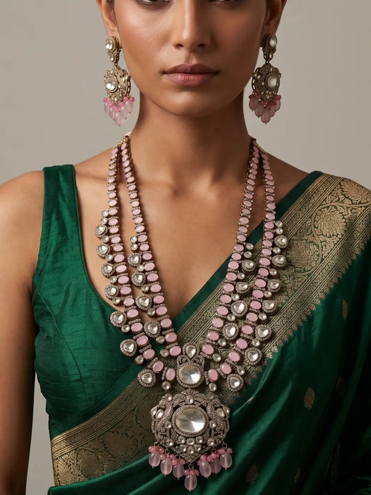 Pink-accented Moissanite Polki necklace featuring layered stone motifs, a statement centre pendant and bridal tikka.