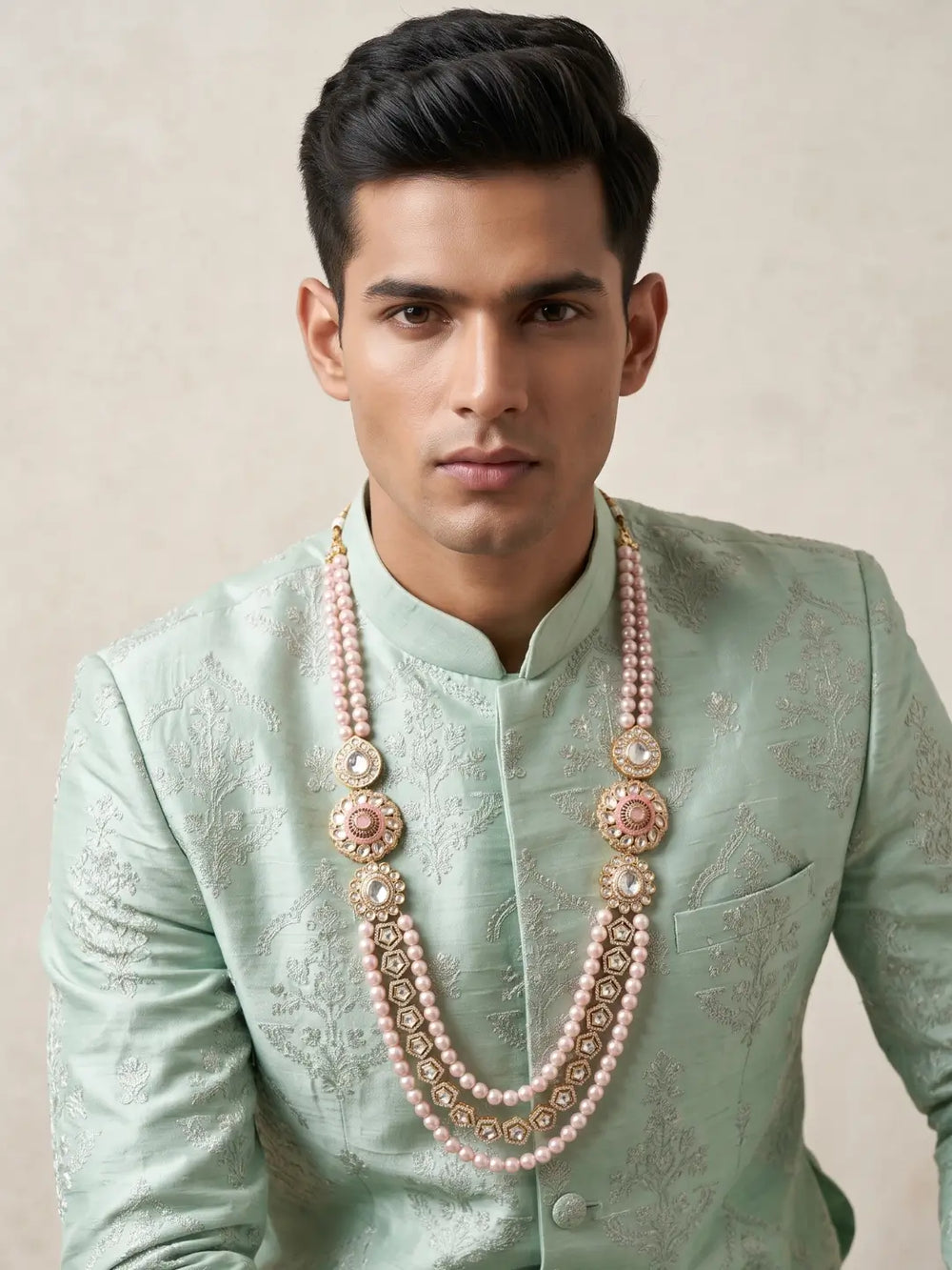 Pink shell pearl Kundan dulha mala with layered beads, ornate Polki brooches and CZ accents, designed for traditional Indian groom sherwanis.
