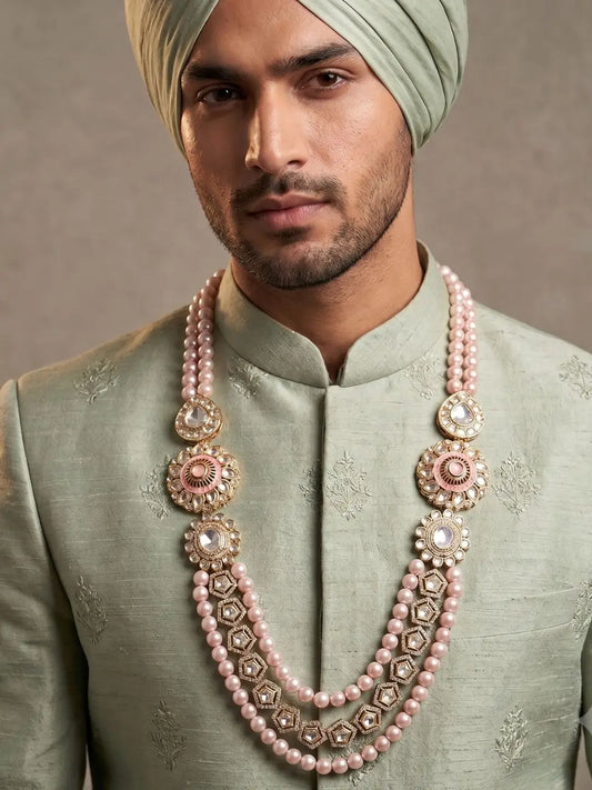 Pink shell pearl Kundan sherwani mala for groom with layered strands, Polki brooches and gold-plated details for Maharaja-style wedding looks.