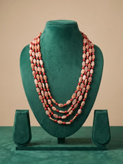 Red coral and moonstone layered mala with multiple strands, styled as a statement beaded necklace for sarees, lehengas and Indo-Western outfits.