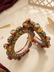 Red and green Meenakari Kundan Gokhru kada bangles with geometric lattice detailing, multicolour stone accents and pearl-style borders.