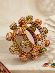 Red and green Meenakari Kundan Gokhru kada bangles featuring white pearl detailing, Kundan stones and a gold-plated base for wedding styling.