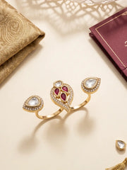 Ruby pink CZ and Polki-style double finger ring with gold plating and pear-shaped motifs, styled for wedding and festive outfits.