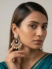 Ruby pink Kundan Chandbali earrings featuring a Polki centre, detailed stonework, enamel accents and cascading pearl drops for festive wear.