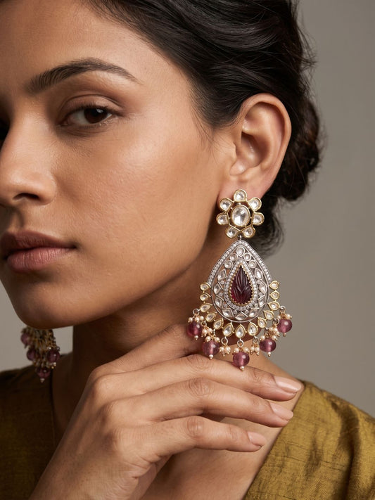 Ruby pink dual tone Kundan Chandbali earrings featuring carved natural teardrop stones, Polki-inspired detailing and delicate pearl hangings.