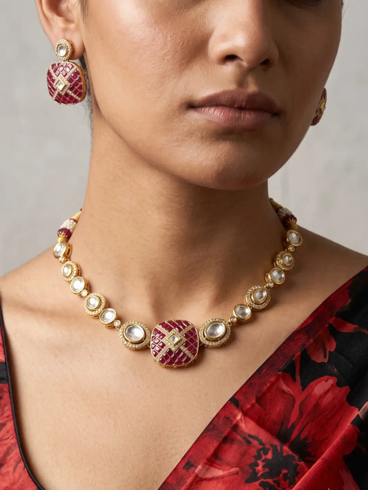 Ruby pink Kundan Polki necklace set with CZ stones, red enamel detailing and matching earrings, designed for weddings and festive occasions.