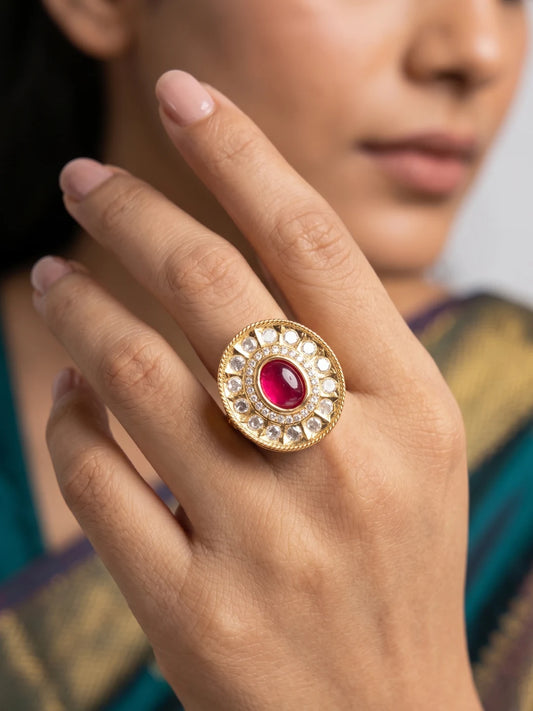 Ruby pink oval Kundan cocktail ring with Polki stonework, shimmering CZ accents and gold plated detailing for wedding and festive jewellery looks