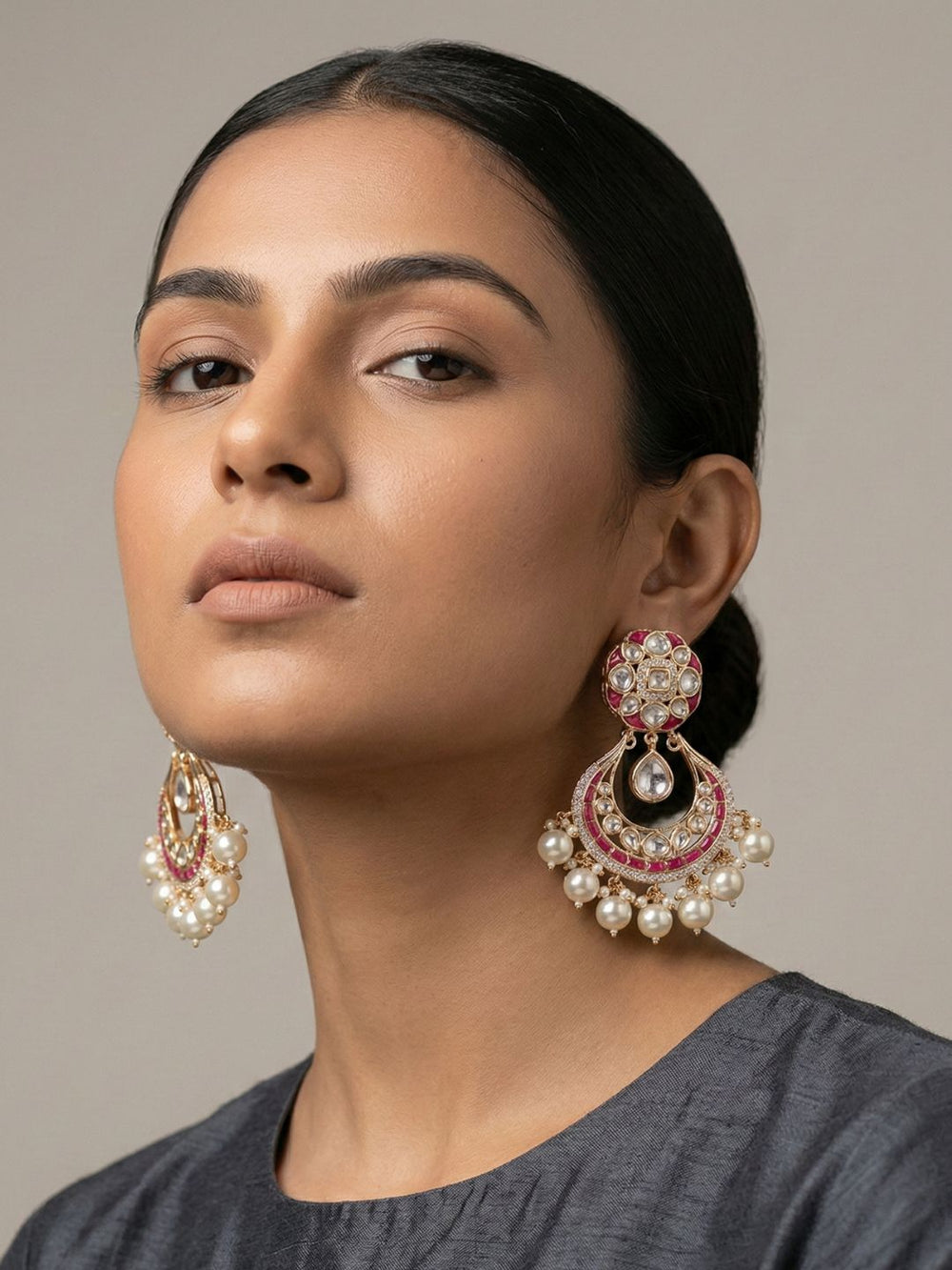 Ruby pink Polki Kundan Chandbali earrings with gold plating, colourful enamel accents, sparkling stones and multiple pearl danglers.