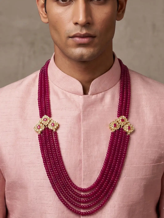 Layered ruby red jade groom mala with gold plated Kundan-style brooches, sparkling stones and ruby-colored accents