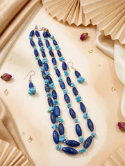 Back closure of a layered blue gemstone beaded necklace showing the adjustable hook-and-eye fastening beside the lapis lazuli and turquoise strands