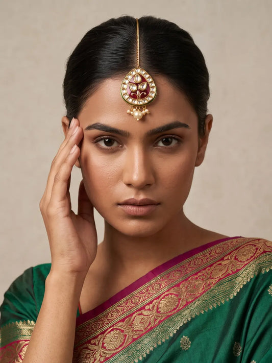 Traditional Gold-Plated Kundan Maang Tikka with Red Meenakari and Pearl Drop Worn on Indian Bridal Model