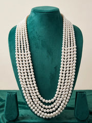 Gold-plated groom necklace featuring multiple strands of white shell pearls and an adjustable dori, suited to sherwanis and traditional Indian wedding outfits.