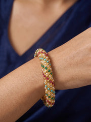 Traditional multicolor Jadau bangles with pink, green and blue stone accents, pearl-style detailing and a gold-tone base for ethnic styling.