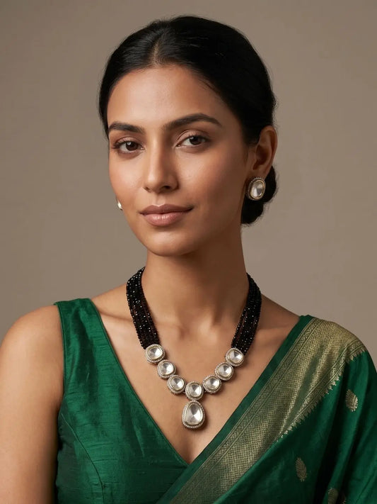 Victorian Polki black beaded necklace set with layered hydro beads, uncut Polki stones, silver-tone detailing and matching stud earrings