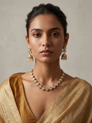White CZ and Polki stone choker necklace set with matching jhumka earrings and gold-tone detailing for ethnic wedding jewellery.
